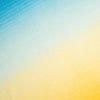 A soft watercolor-style gradient cashmere transitioning from light blue at the top left to pale cream and warm yellow at the bottom right.