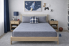 Organic cotton jersey knit sheet set on a neatly made bed