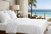 Organic cotton percale sheets on a bed