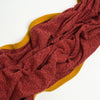 Terracotta Heather cashmere throw blanket with Golden Ochre trim, open